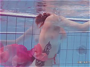 red-haired dancing in the pool